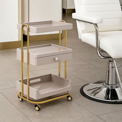 Luxury 3-Tier Salon Trolley in Pigeon Grey & Golden Frame with Drawer and Wheels – Multi-Purpose trolley - Salon serving trolley Saudi Arabia - salon trolley Qatar - Al Basel Cosmetics - UAE